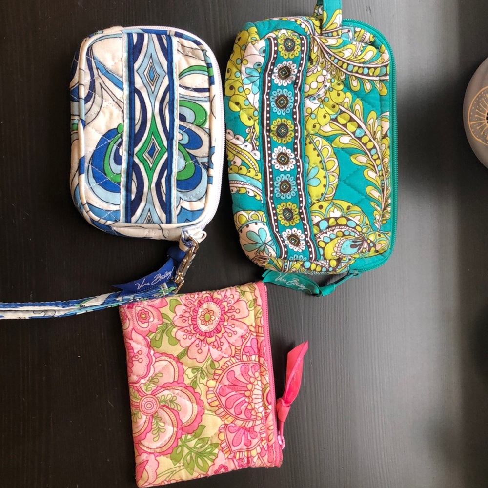 Three small Vera Bradley pouches.